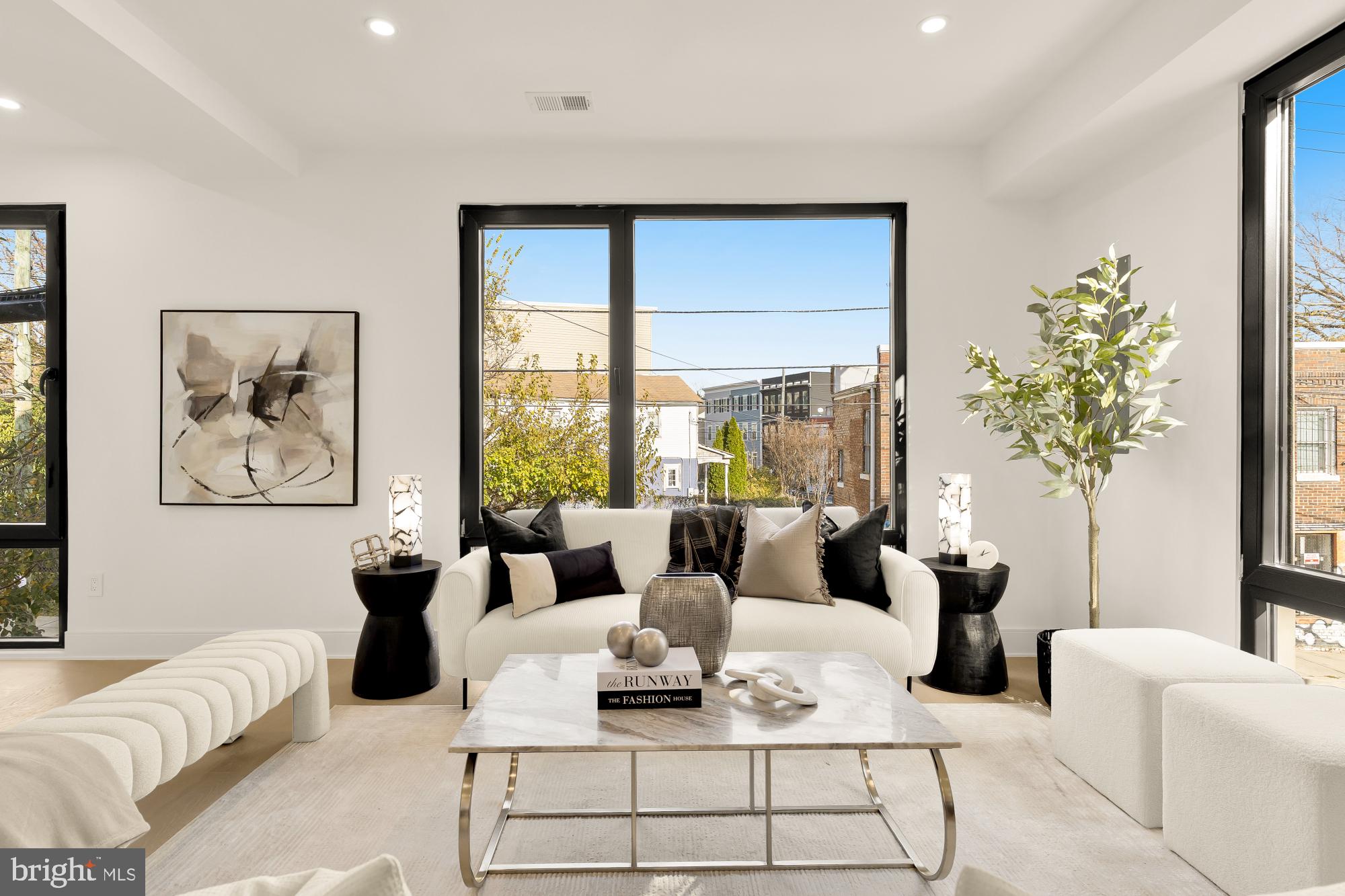 1810 Central Place Northeast, Unit 2 Washington, DC 20002 - Photo 2 of 34 a living room with furniture and a large window