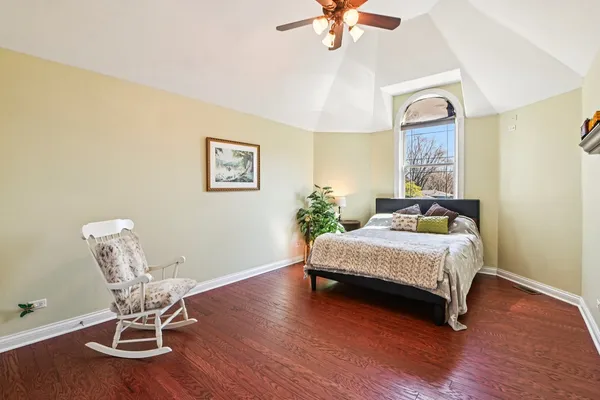 a bedroom with double bed and a window