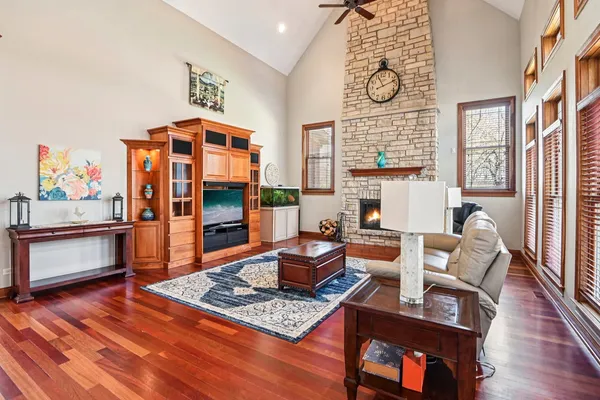 a living room with furniture flat screen tv and a fireplace