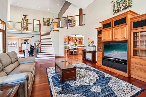a dining room with furniture a window and wooden floor