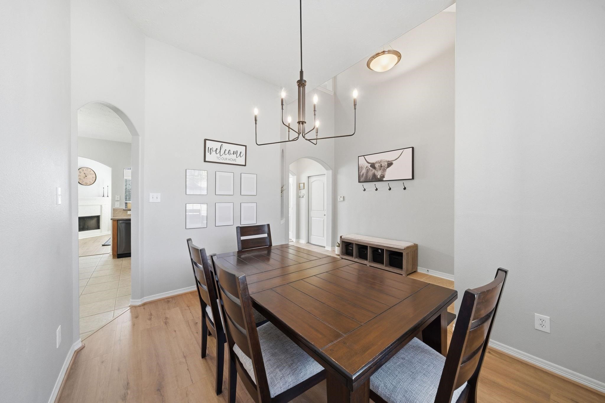 9207 Hidden Court Magnolia, TX 77354 - Photo 6 of 26 a view of a dining room with furniture and wooden floor
