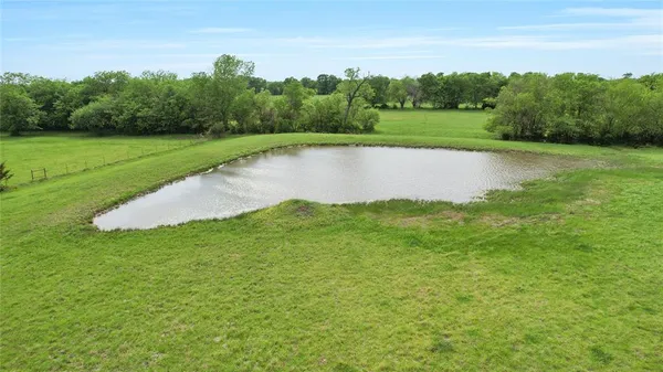 a view of a lake with a big yard