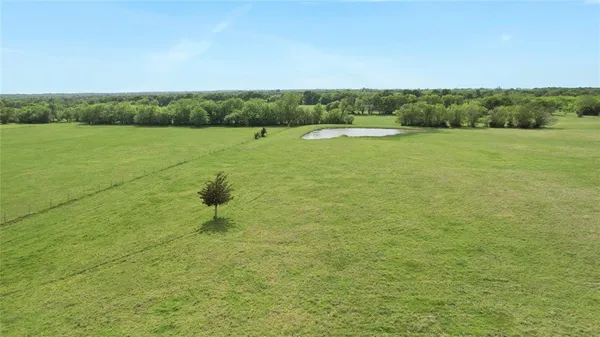 a view of a lake with a yard