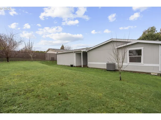 a backyard of a house with lots of green space