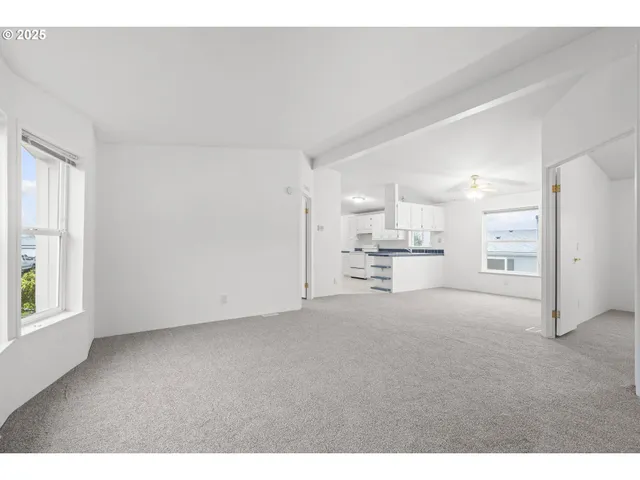 a view of kitchen and refrigerator