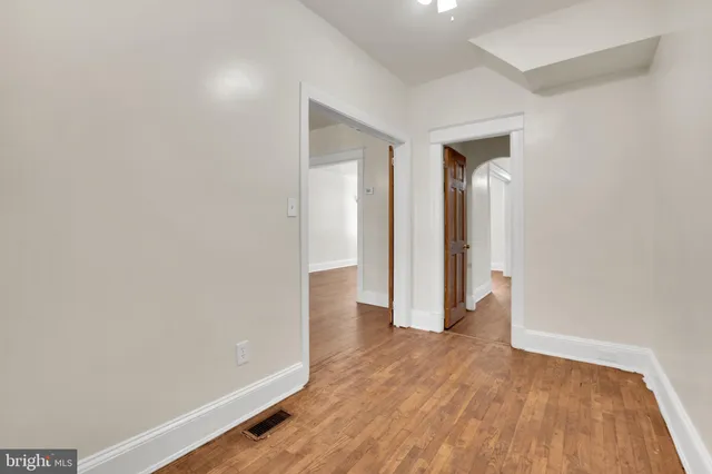 a view of wooden floor in an empty room