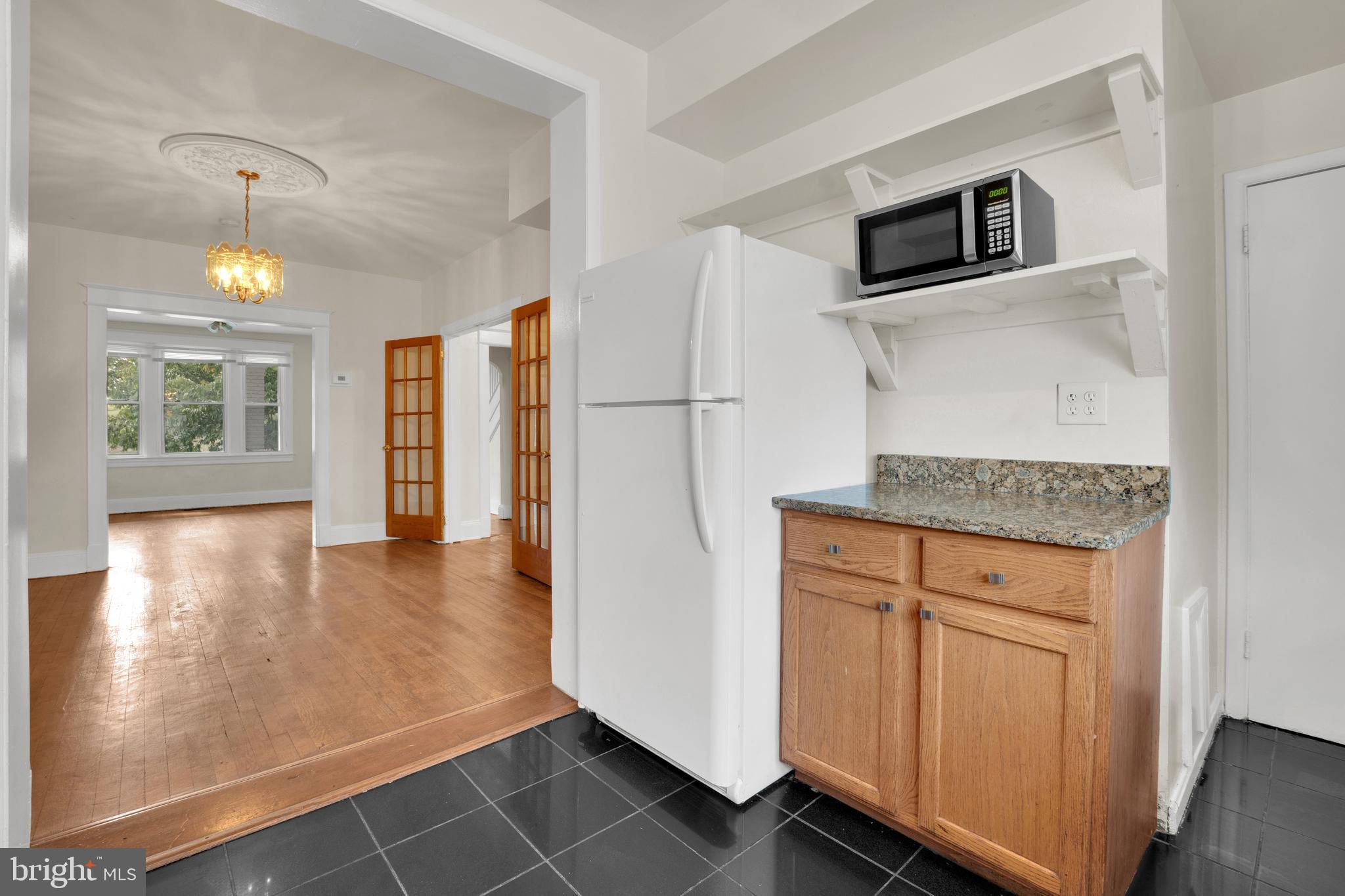 5731 9th Street Northwest Washington, DC 20011 - Photo 16 of 36 a kitchen with stainless steel appliances granite countertop a refrigerator and a stove