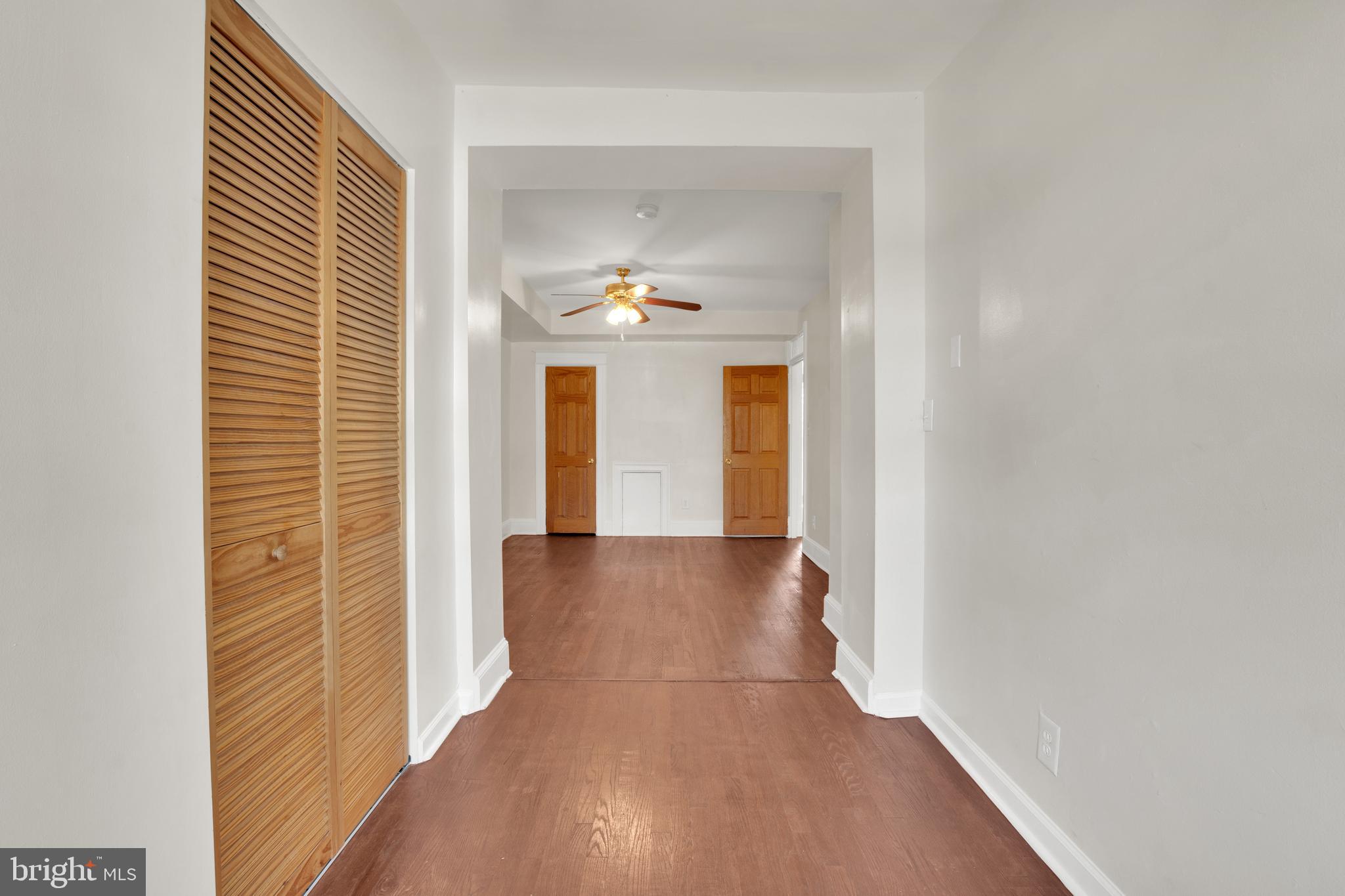 5731 9th Street Northwest Washington, DC 20011 - Photo 23 of 36 a view of a hallway with wooden floor and a large window