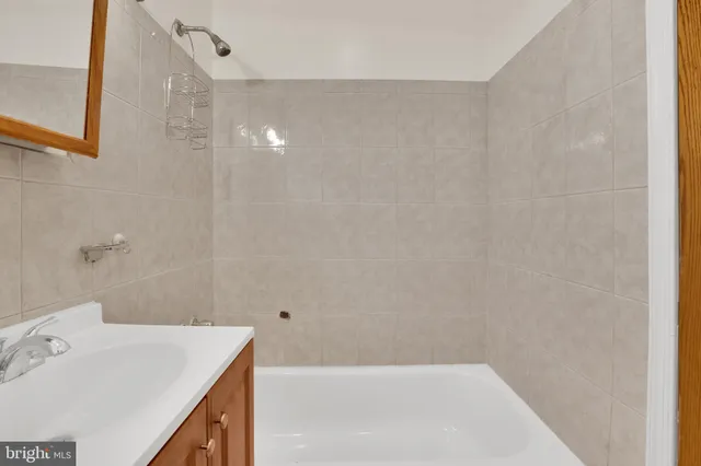 a bathroom with a sink and a bathtub