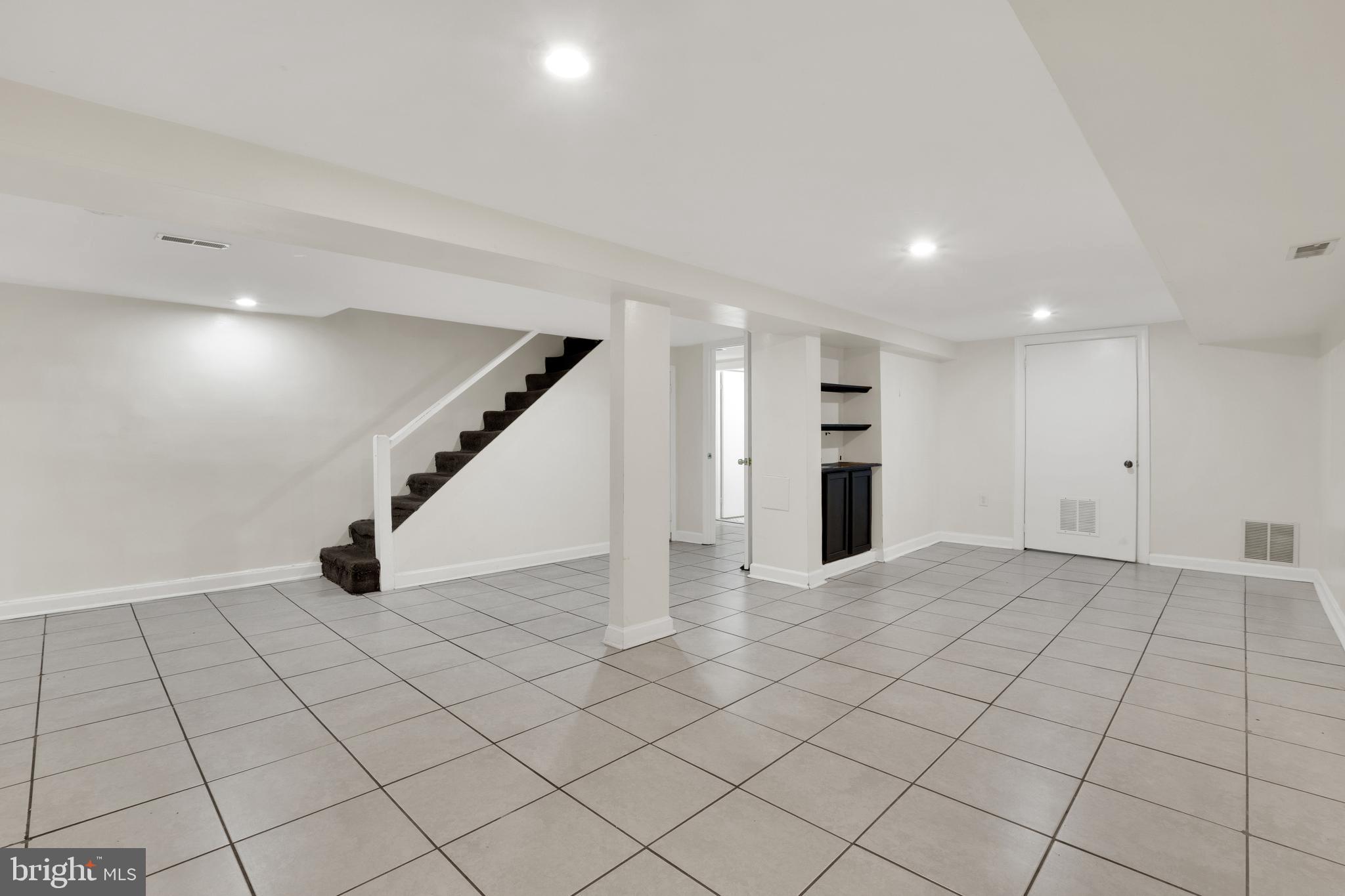 5731 9th Street Northwest Washington, DC 20011 - Photo 27 of 36 an empty room with windows