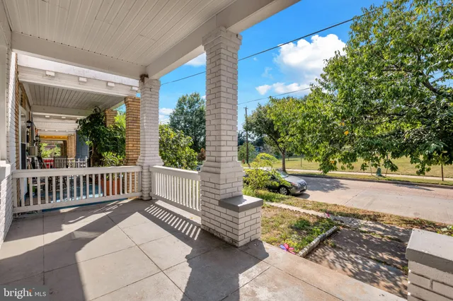 a view of a deck with couches and wooden floor