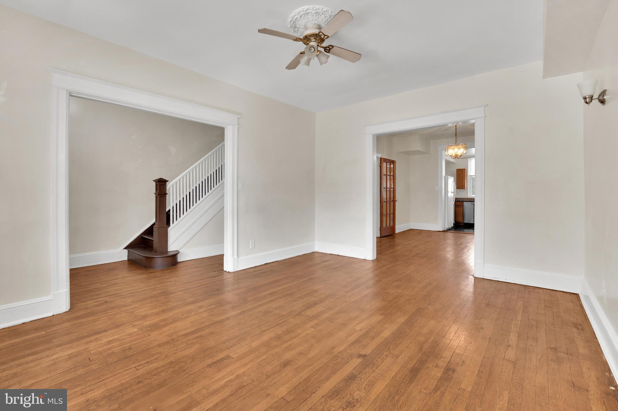 5731 9th Street Northwest Washington, DC 20011 - Photo 5 of 36 a view of a room with wooden floor and a ceiling fan