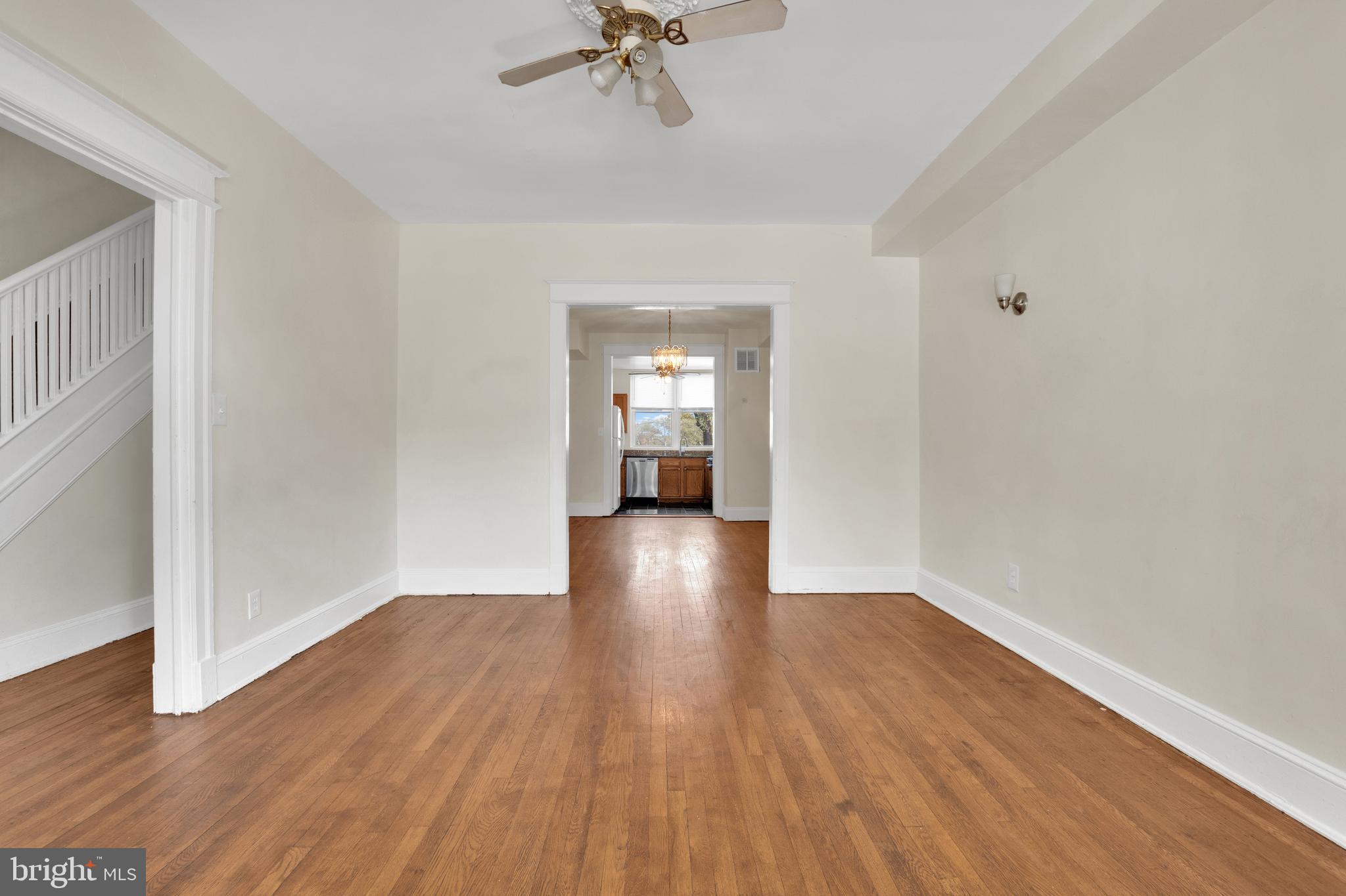5731 9th Street Northwest Washington, DC 20011 - Photo 6 of 36 a view of a room with wooden floor and ceiling fan