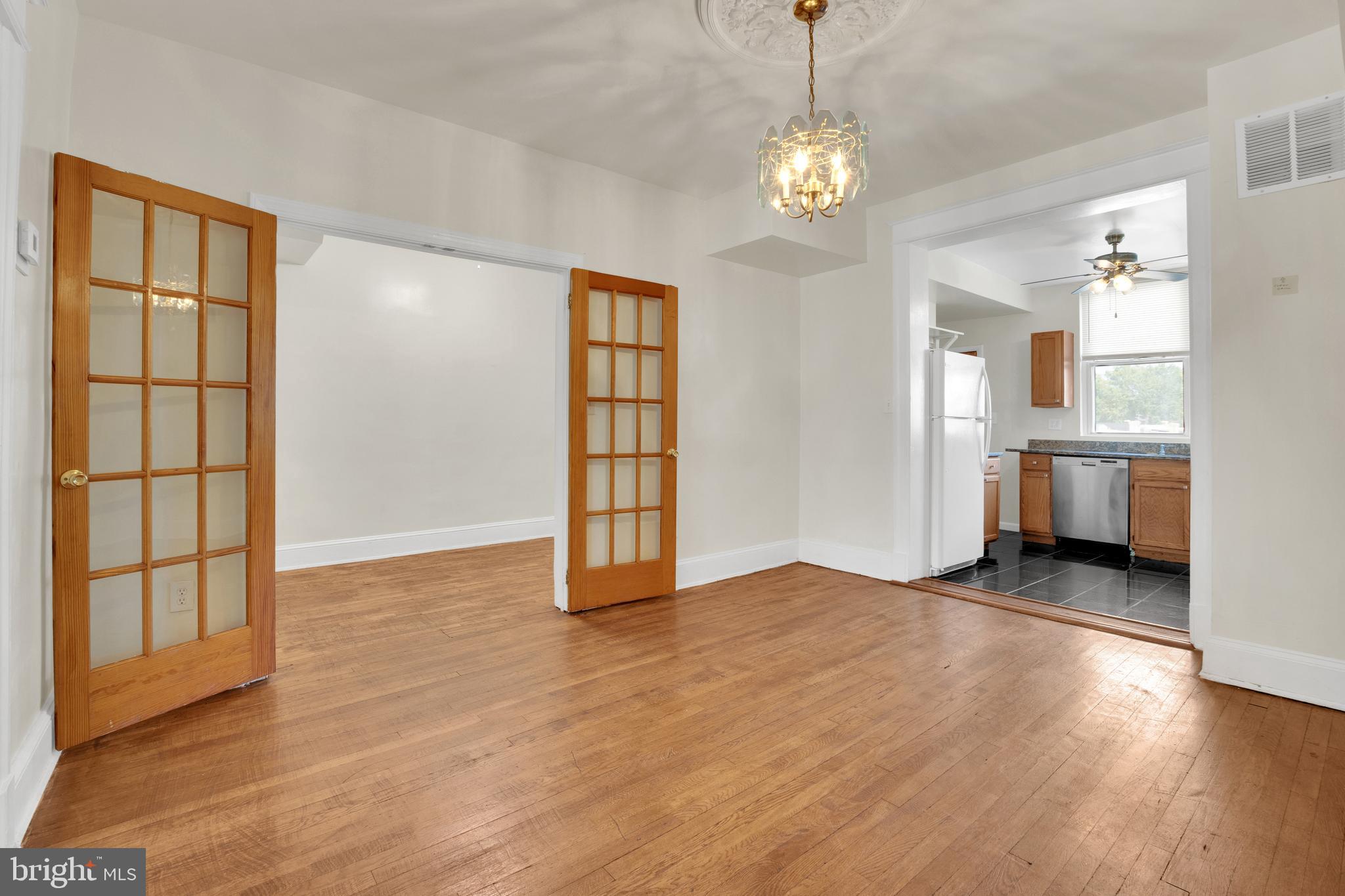 5731 9th Street Northwest Washington, DC 20011 - Photo 9 of 36 a view of an empty room with window and wooden floor