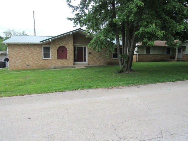 a large white house with a white fence