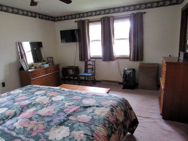 309 Cedar Drive Clinton, IL 61727 - Photo 12 of 20 a bedroom with a bed and furniture