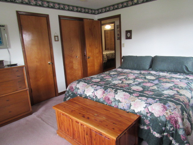 309 Cedar Drive Clinton, IL 61727 - Photo 13 of 20 a bedroom with a bed and a mirror