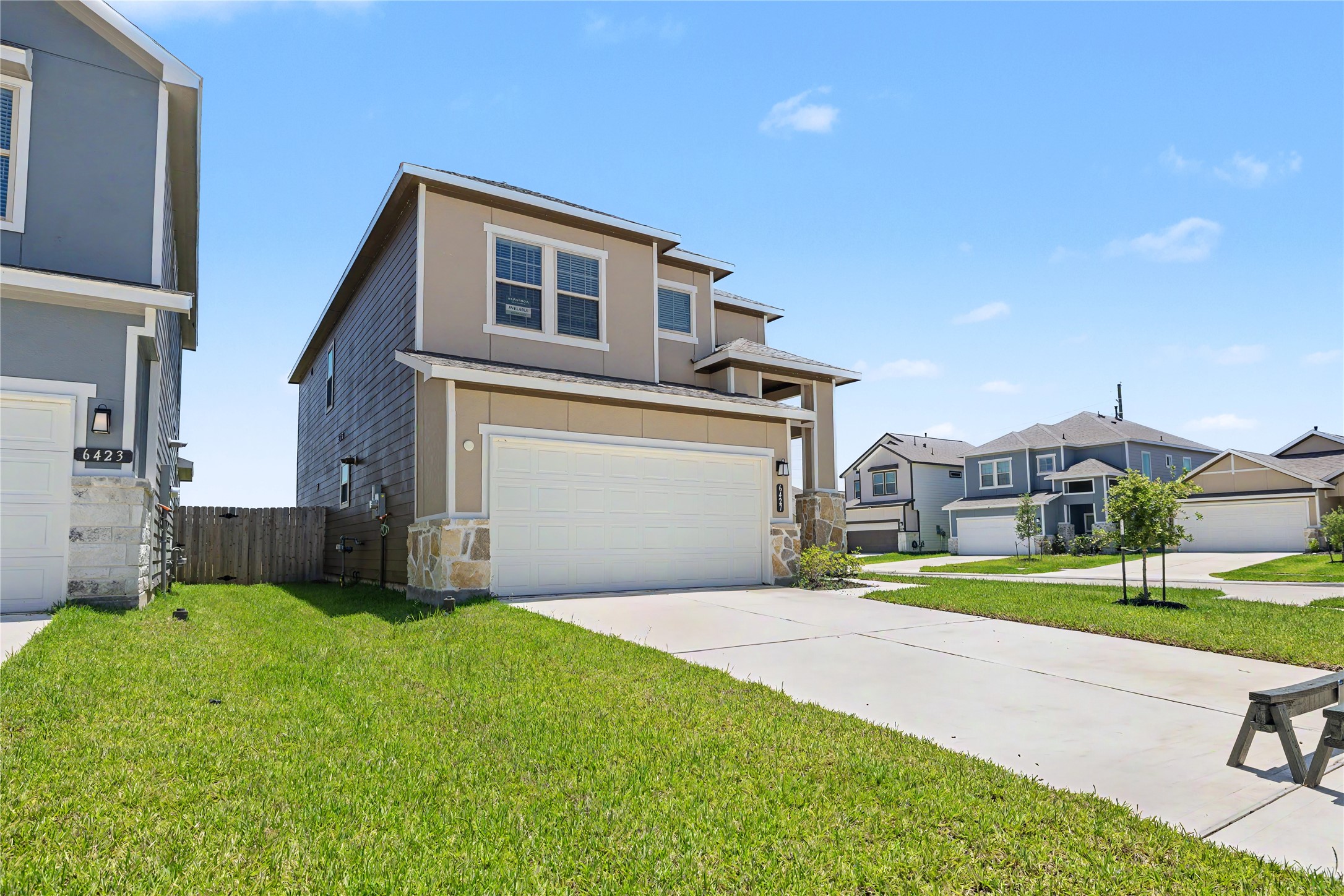 6427 Bolinas Court Rosharon, TX 77583 - Photo 2 of 49 a front view of a house with a yard and garage
