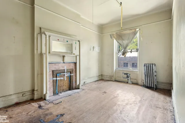 a view of a brick house with a large window