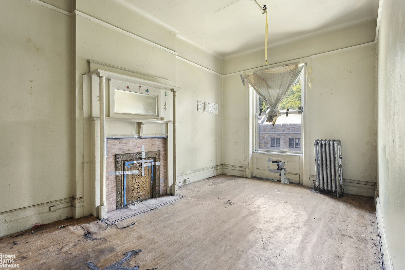 54 Edgecombe Avenue Manhattan, NY 10030 - Photo 4 of 6 a view of empty room with a fireplace and windows