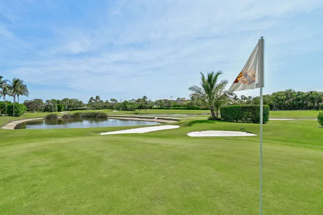 a view of a swimming pool and a yard