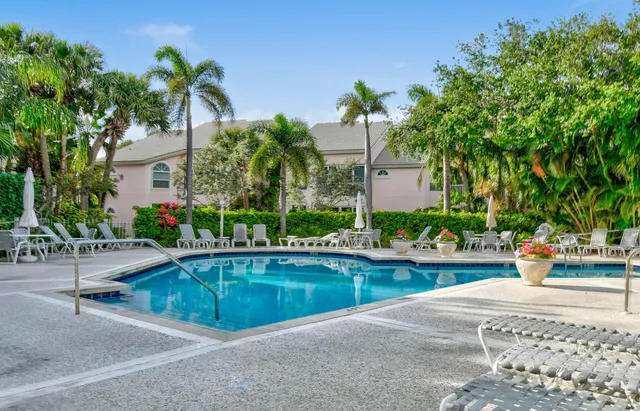a view of a swimming pool with a patio