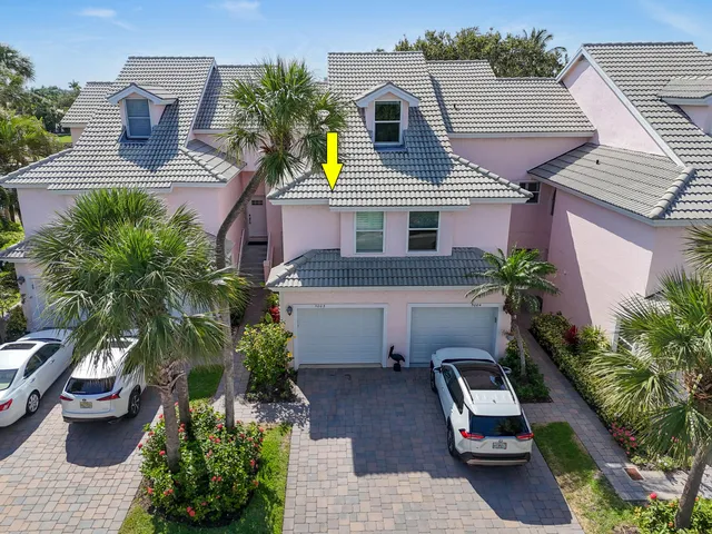 an aerial view of a house with a lake view