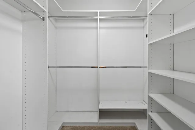 a bathroom with a shower and a sink