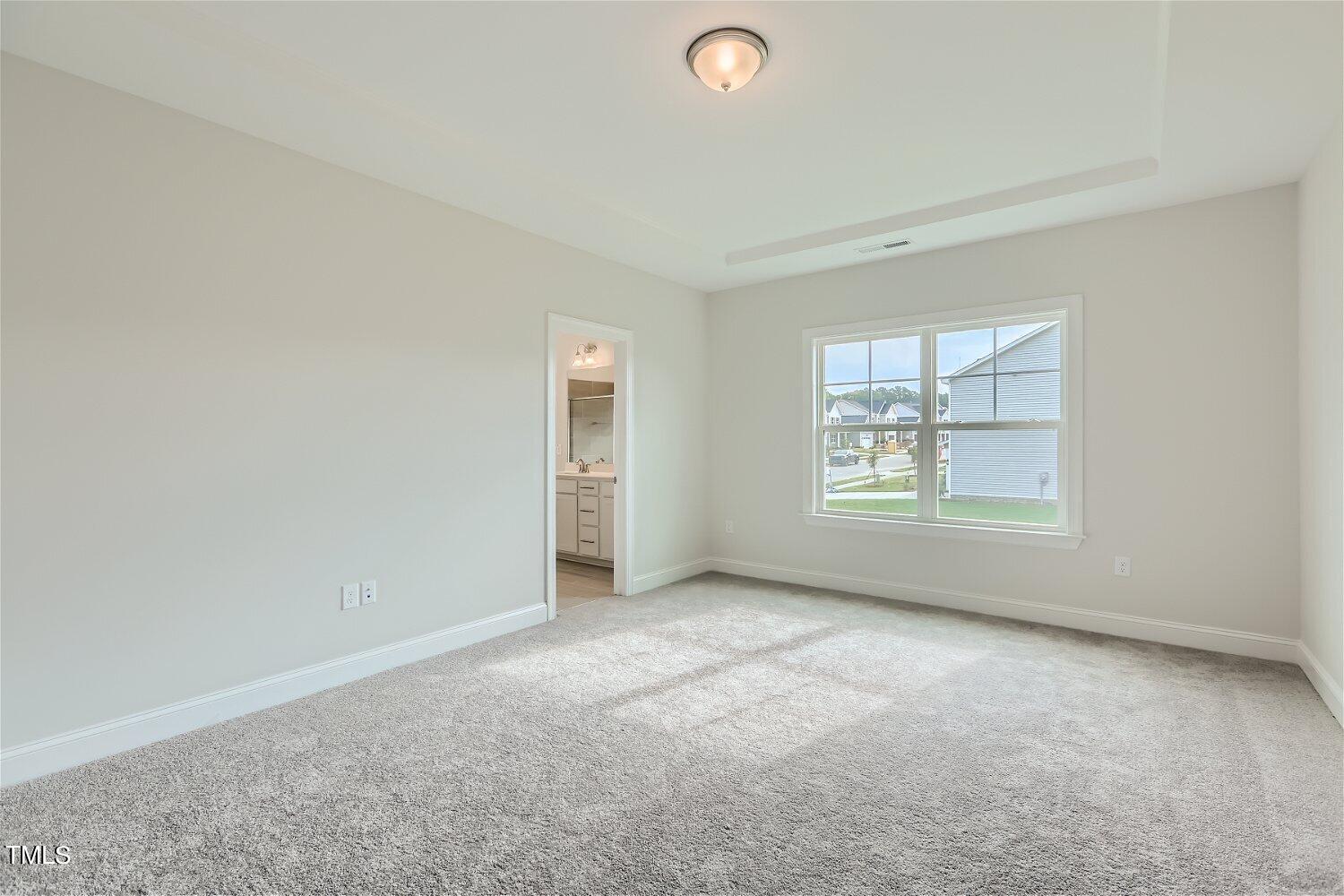544 Tanner Lake Lane, Unit 294 Raleigh, NC 27610 - Photo 8 of 16 an empty room with windows