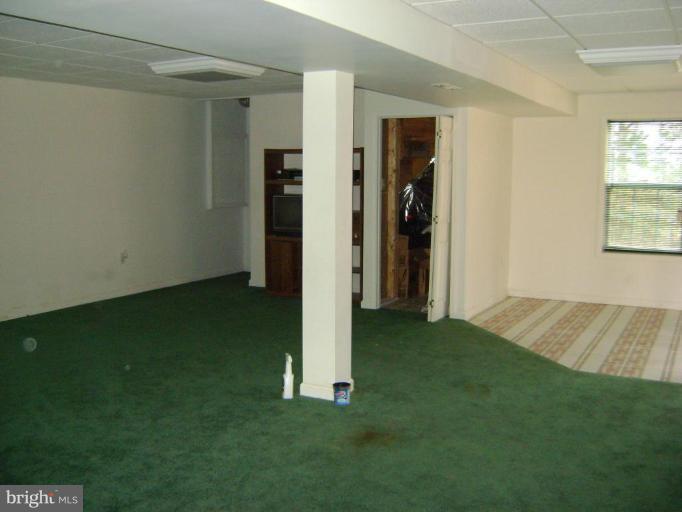 670 San Gabriel Road Lusby, MD 20657 - Photo 7 of 10 a view of an empty room with closet and a window
