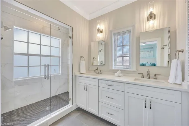 a spacious bedroom with a bed and a window