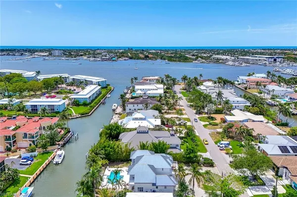 an aerial view of a house with a lake view