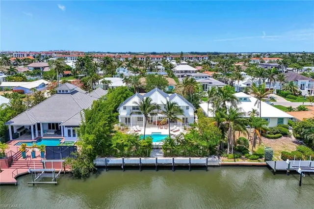 a front view of a house with a garden and plants