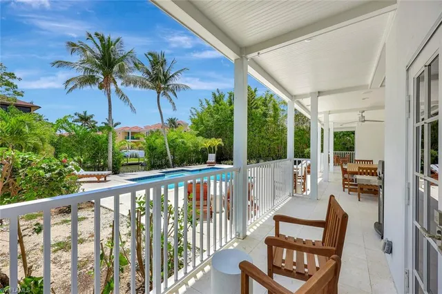 swimming pool view with a sitting space