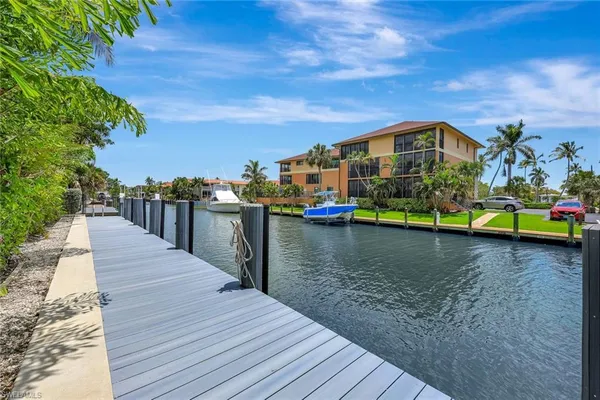 a view of yard with swimming pool and furniture