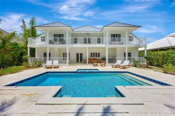 an aerial view of a city with ocean view