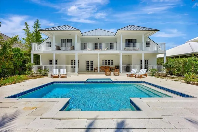 an aerial view of a city with ocean view