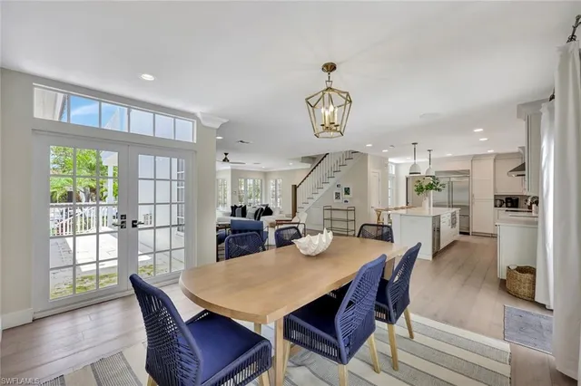 a balcony with wooden floor and outdoor seating