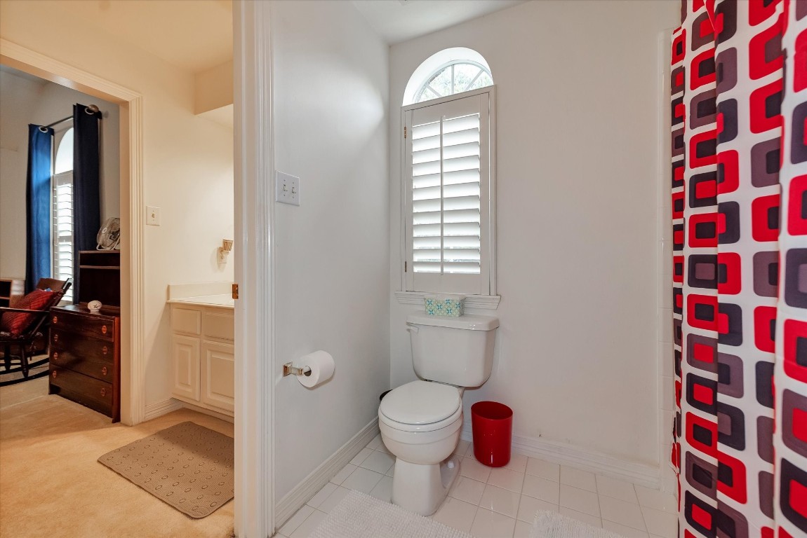 5718 Oakmoss Trail Spring, TX 77379 - Photo 37 of 50 Dual-access Jack-and-Jill bathroom with stylish accents and convenient layout.