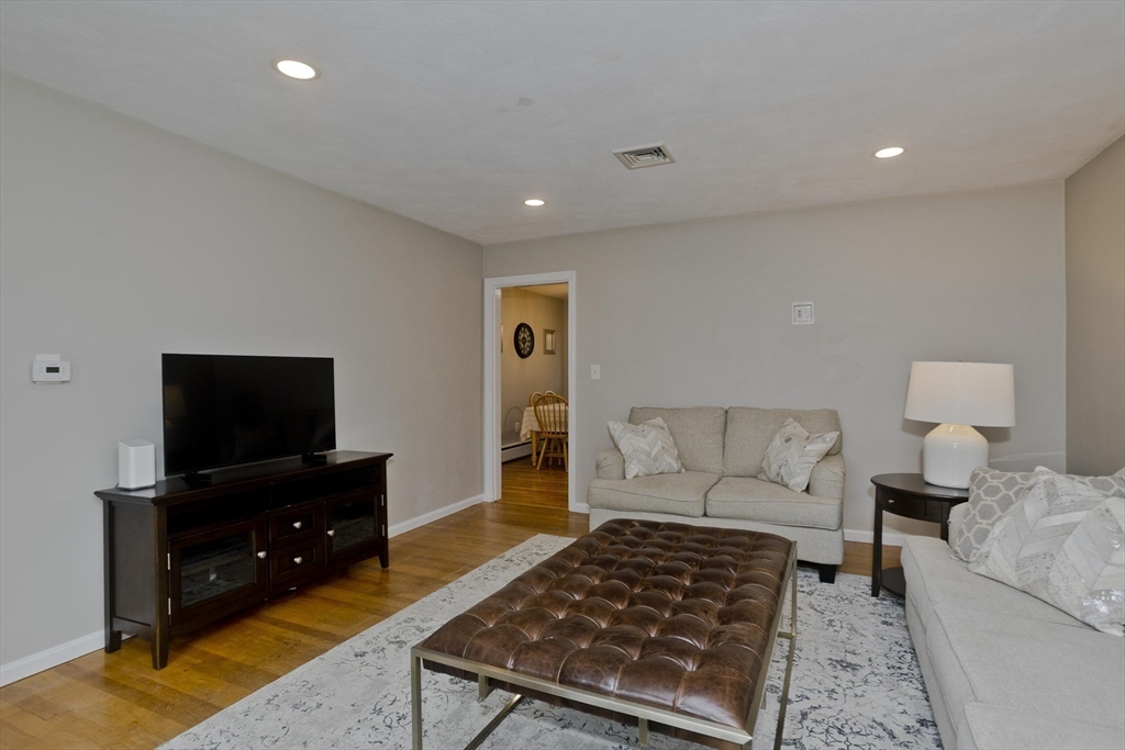 213 Spring Grove Avenue Northampton, MA 01062 - Photo 17 of 41 a living room with furniture and a flat screen tv