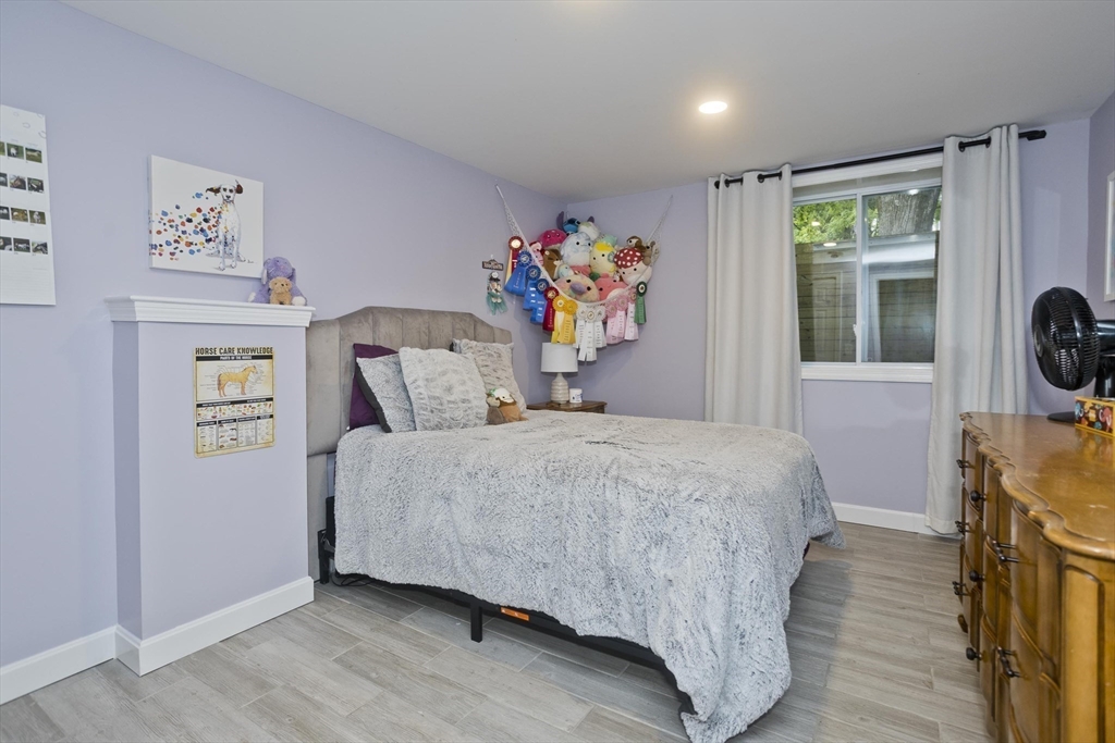 213 Spring Grove Avenue Northampton, MA 01062 - Photo 31 of 41 a bedroom with a bed and glass window