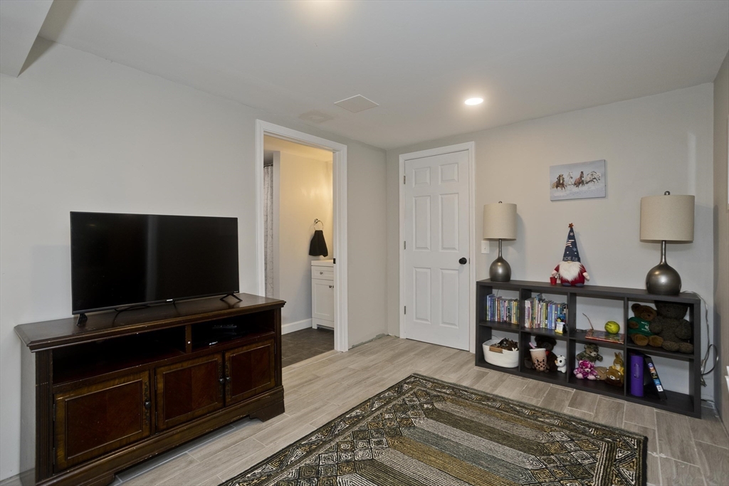 213 Spring Grove Avenue Northampton, MA 01062 - Photo 33 of 41 a living room with furniture and a flat screen tv