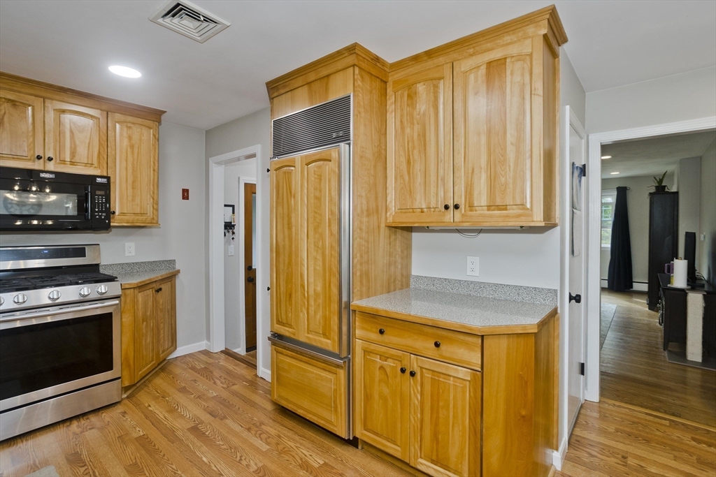 213 Spring Grove Avenue Northampton, MA 01062 - Photo 10 of 41 a kitchen with stainless steel appliances granite countertop a refrigerator and a stove top oven