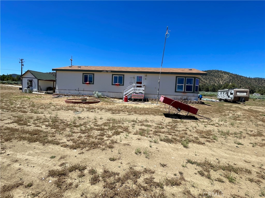 12955 Boy Scout Camp Road Frazier Park, CA 93225 - Photo 14 of 14 a backyard of a house with barbeque oven and outdoor seating