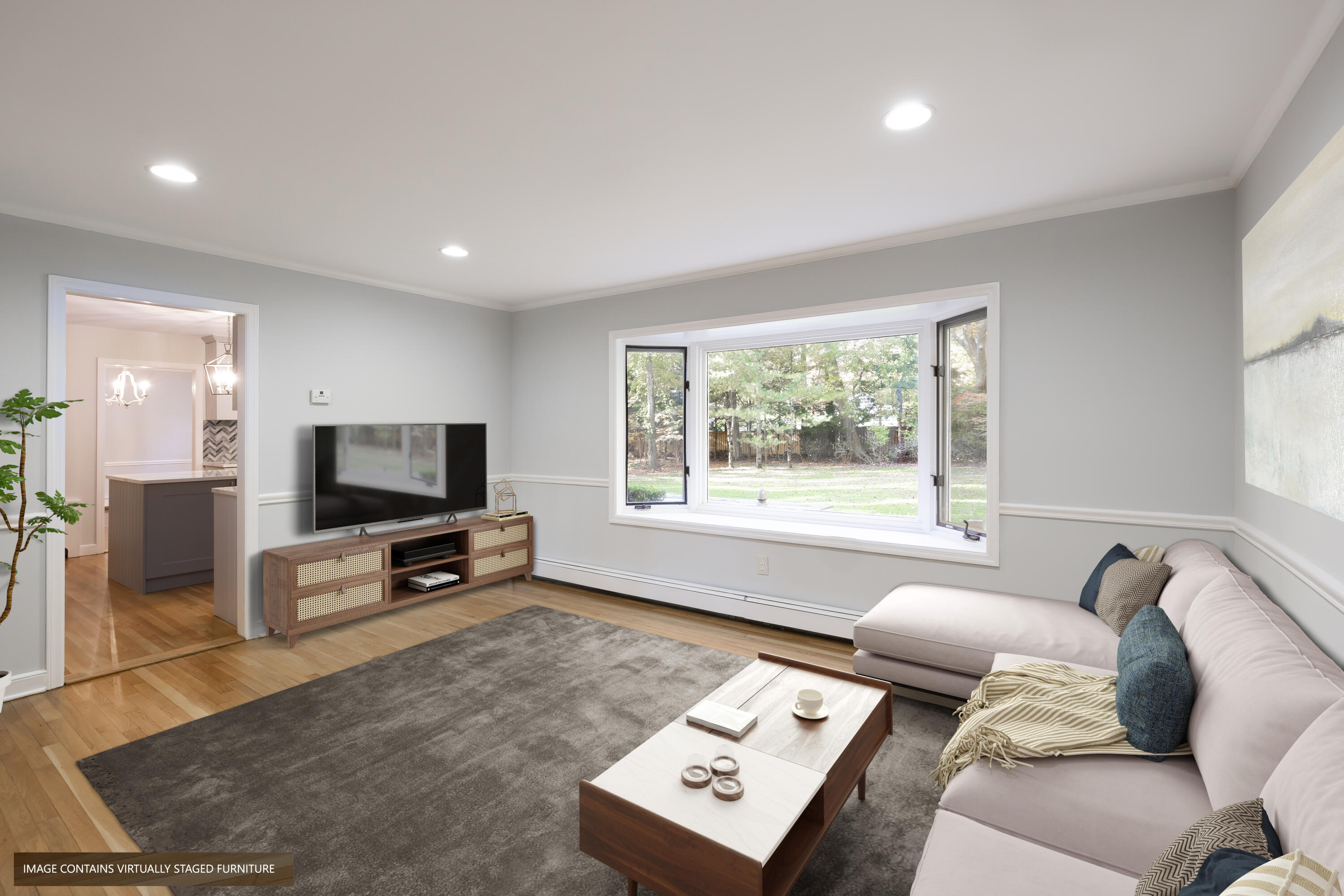 10 Pilgrim Road Darien, CT 06820 - Photo 14 of 31 a living room with furniture and a flat screen tv