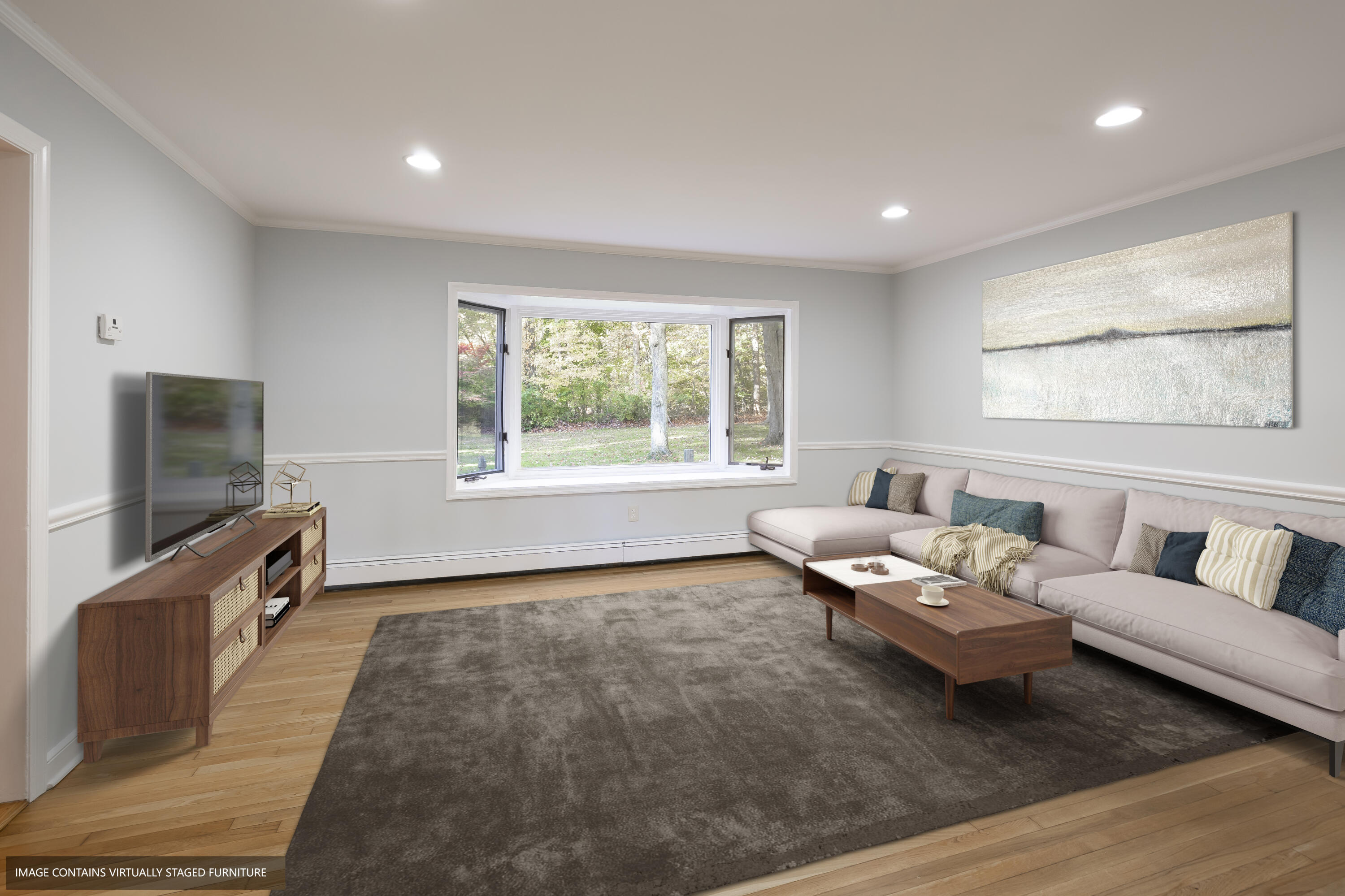 10 Pilgrim Road Darien, CT 06820 - Photo 15 of 31 a living room with furniture and a flat screen tv