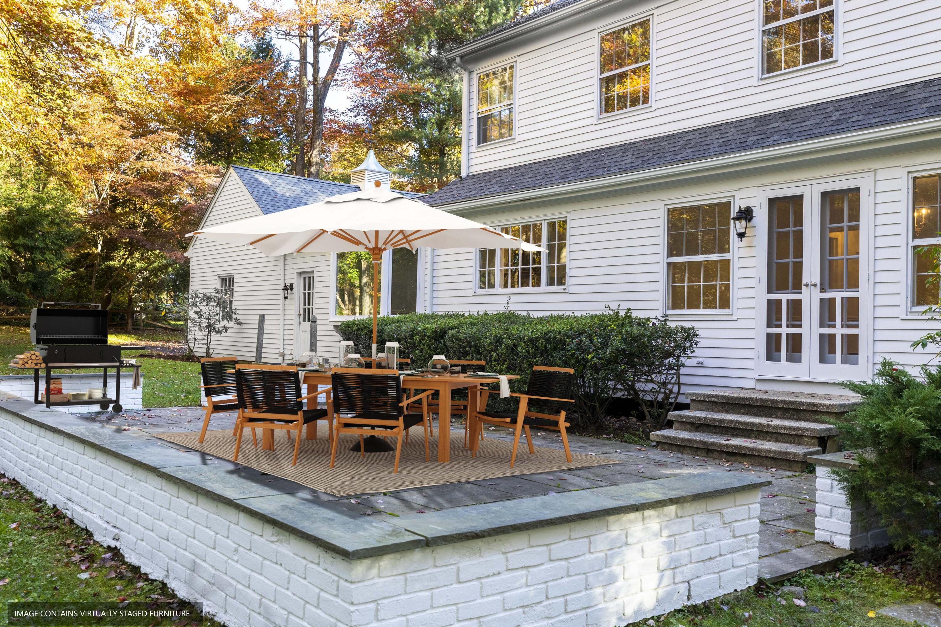 10 Pilgrim Road Darien, CT 06820 - Photo 29 of 31 a view of a house with patio and sitting area
