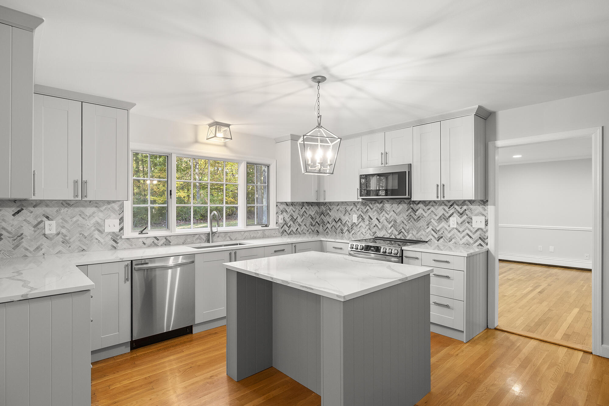 10 Pilgrim Road Darien, CT 06820 - Photo 10 of 31 a kitchen with a sink stove and cabinets