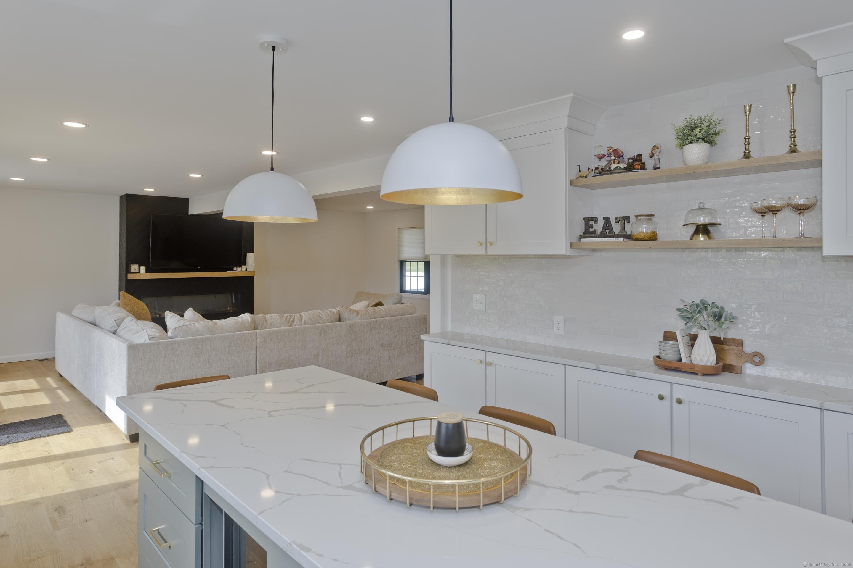 56 Margaret Street Monson, MA 01057 - Photo 12 of 39 a kitchen with a sink a stove and a wooden floor