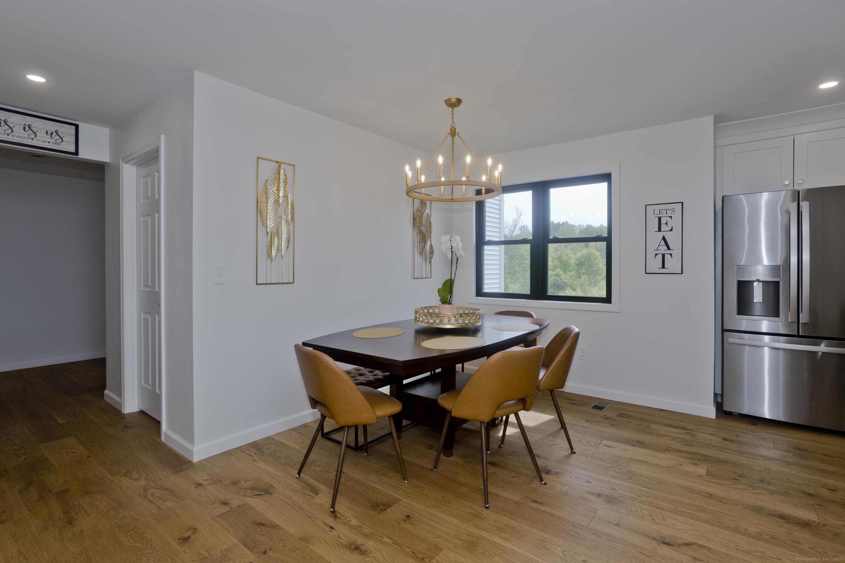 56 Margaret Street Monson, MA 01057 - Photo 13 of 39 a dining room with furniture a chandelier and wooden floor